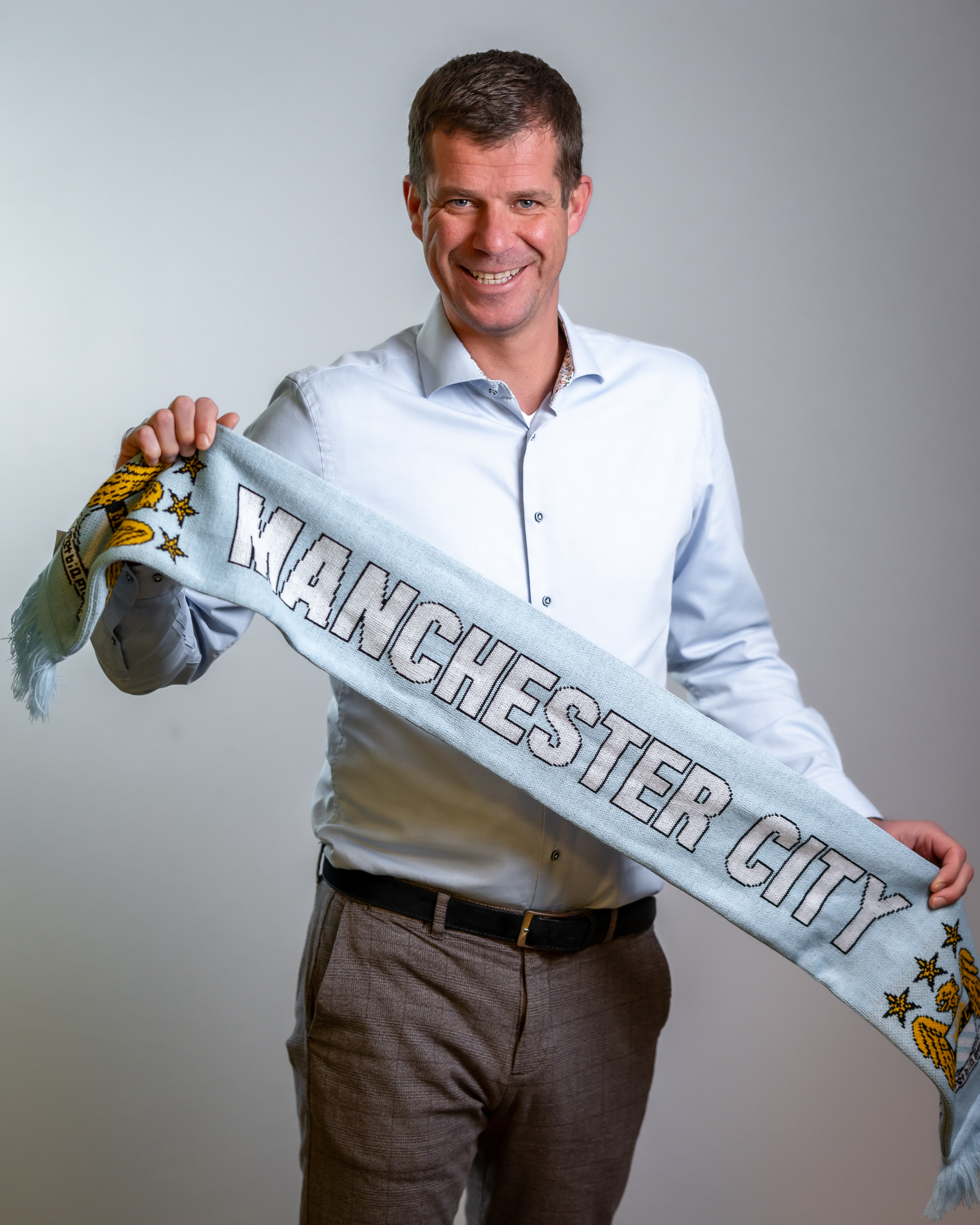 Founder van TFTA met Manchester City sjaal